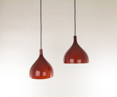 Two red Venini pendants by Massimo Vignelli