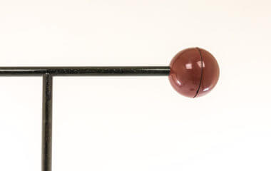The red ball of a Tomo floor lamp by Toshiyuki Kita for Luci Italia