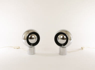 A pair of chrome Eclisse table lamps attributed to Reggiani in their full glory