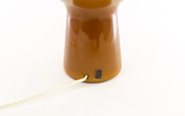 The Venini sticker on a hand-blown amber Fungo table lamp (medium) by Massimo Vignelli for Venini