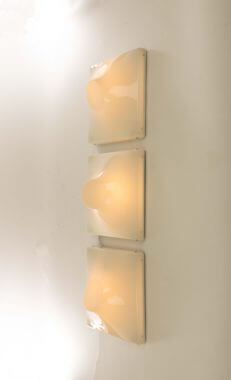 Set of three wall lamps by Ennio Chiggio for Emmezeta, switched on