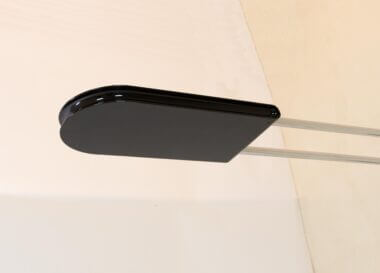 The reflector of a black Gesto wall lamp by Bruno Gecchelin for Skipper