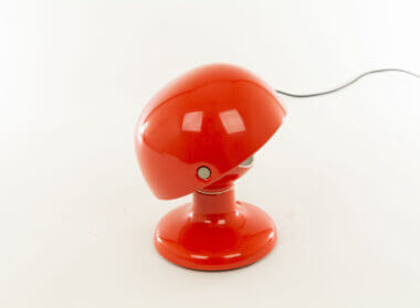 Red Jucker table lamp by Tobia Scarpa for Flos as seen from one side