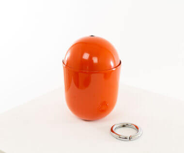 Orange Elmo table lamp by Imago DP, with focus on the ring that gives the lamp balance