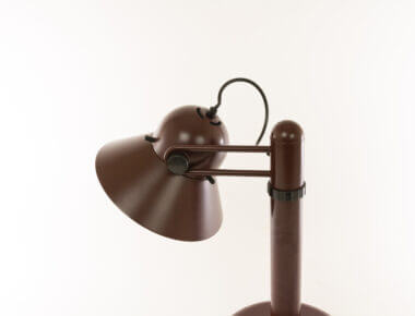 The top of a brown table lamp by Gae Aulenti for Stilnovo