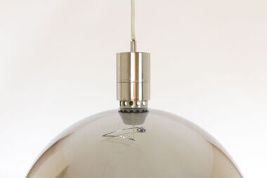 The top part of the semi sphere of a chrome pendant by Franca Helg, Franco Albin and Antonio Piva for Sirrah