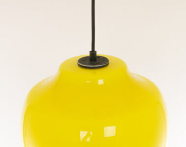 The metal part on top of a yellow glass pendant by Alessandro Pianon for Vistosi