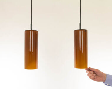 Pair of amber colored pendants by Venini with an indication of the size