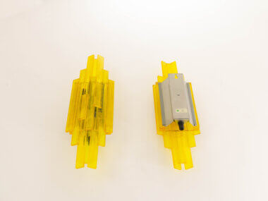 Both sides of a pair of yellow wall lamps by Claus Bolby for Cebo Industri