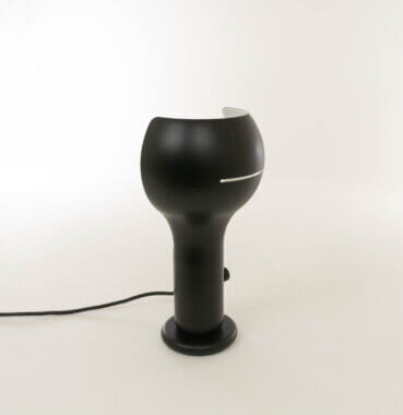 Black Flash Table lamp model by Joe Colombo for O-Luce, seen from one side