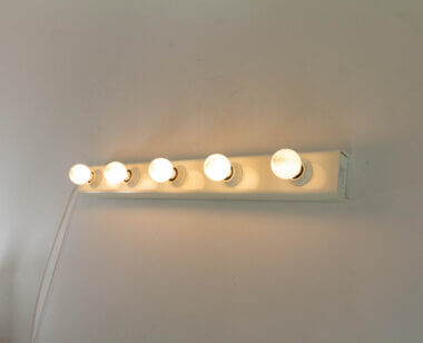 Model 50 Wall lamp by Gino Sarfatti for Arteluce, switched on