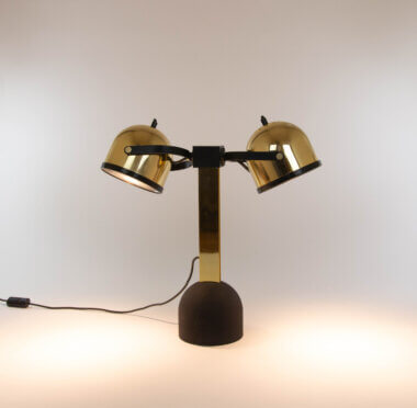 The left brass Trepiù table lamp by Gae Aulenti and Livio Castiglioni for Stilnovo, switched on