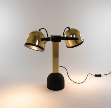 The right Trepiù table lamp by Gae Aulenti and Livio Castiglioni for Stilnovo, switched on