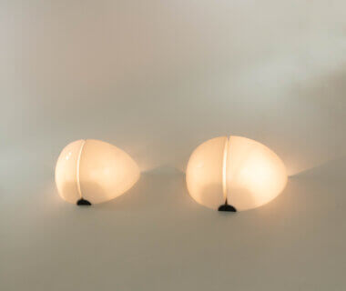 Pair of Spicchio wall lamps by Corrado and Danilo Aroldi for Stilnovo, as seen from below and switched on