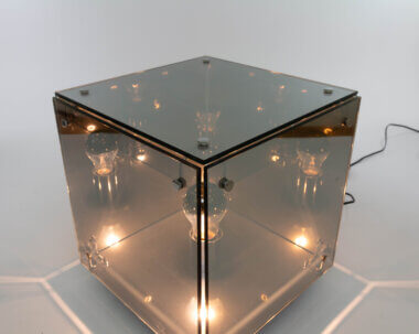 The mirror liked glass of a Prismar table lamp by Studio A.R.D.I.T.I. for Nucleo Sormani