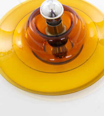 A detailed view from an amber wall or ceiling Lamp by Venini for Pierre Cardin