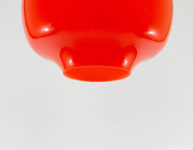 The bottom of a red glass pendant by Alessandro Pianon for Vistosi