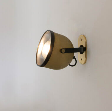 As an example, one out of a set of nine wall lamps by Gae Aulenti and Livio Castiglioni for Stilnovo, switched on