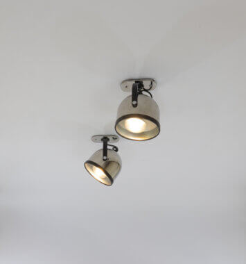 A pair of ceiling lamps by Gae Aulenti and Livio Castiglioni for Stilnovo, switched on