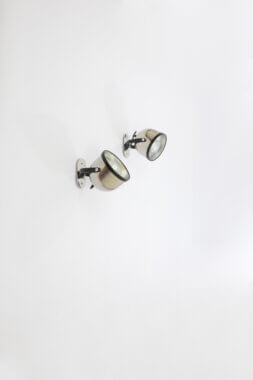 A pair of wall lamps by Gae Aulenti and Livio Castiglioni for Stilnovo, seen from a distance
